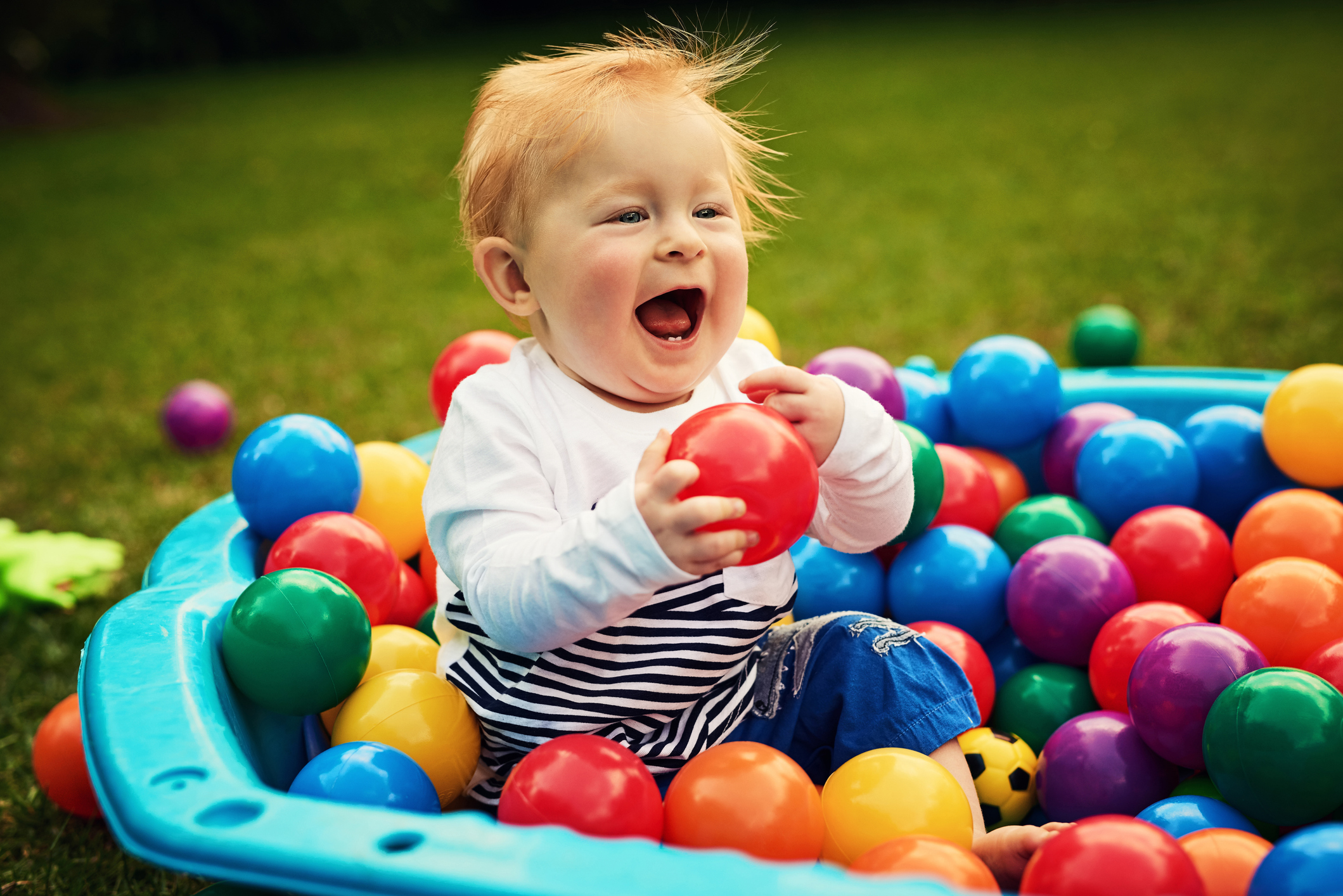 Shot of an adorable little boy playing in the backyard